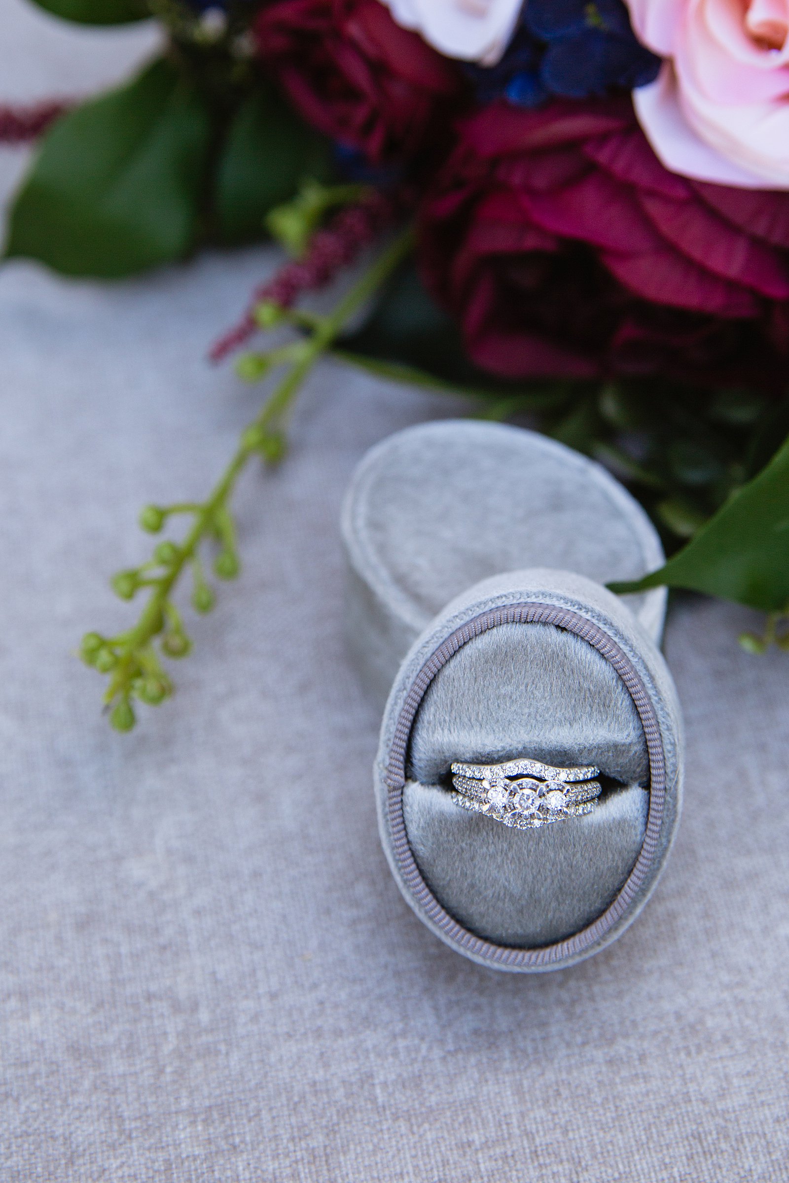 Brides's wedding day details of a white gold and diamond wedding ring by PMA Photography.