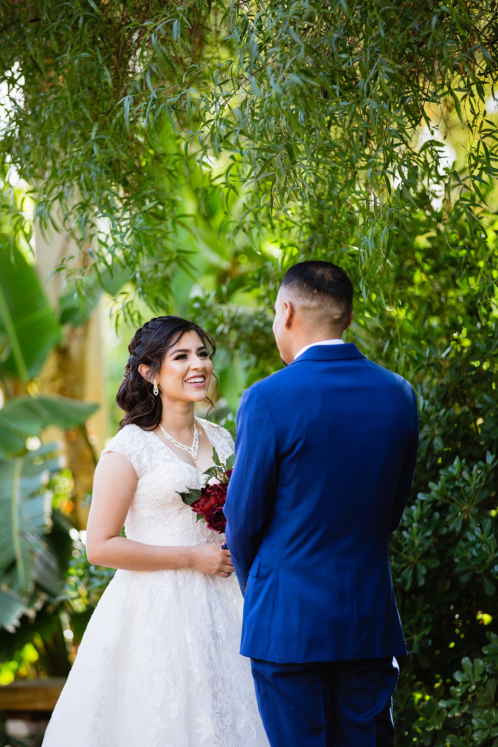 Bride and Groom's first look at Valley Garden Center by Phoenix wedding photographer PMA Photography.