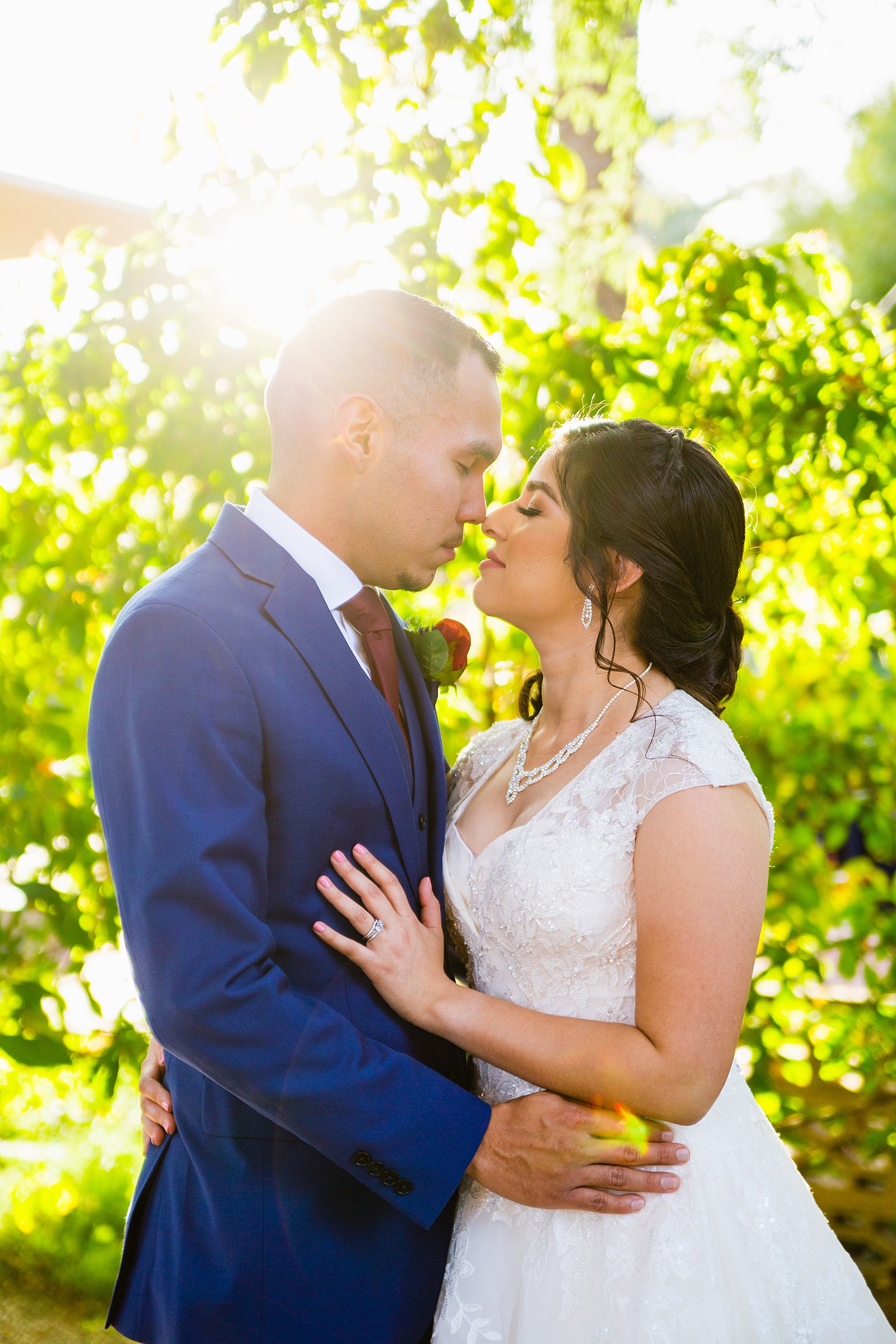Bride and Groom share an intimate moment at their Valley Garden Center wedding by Arizona wedding photographer PMA Photography.