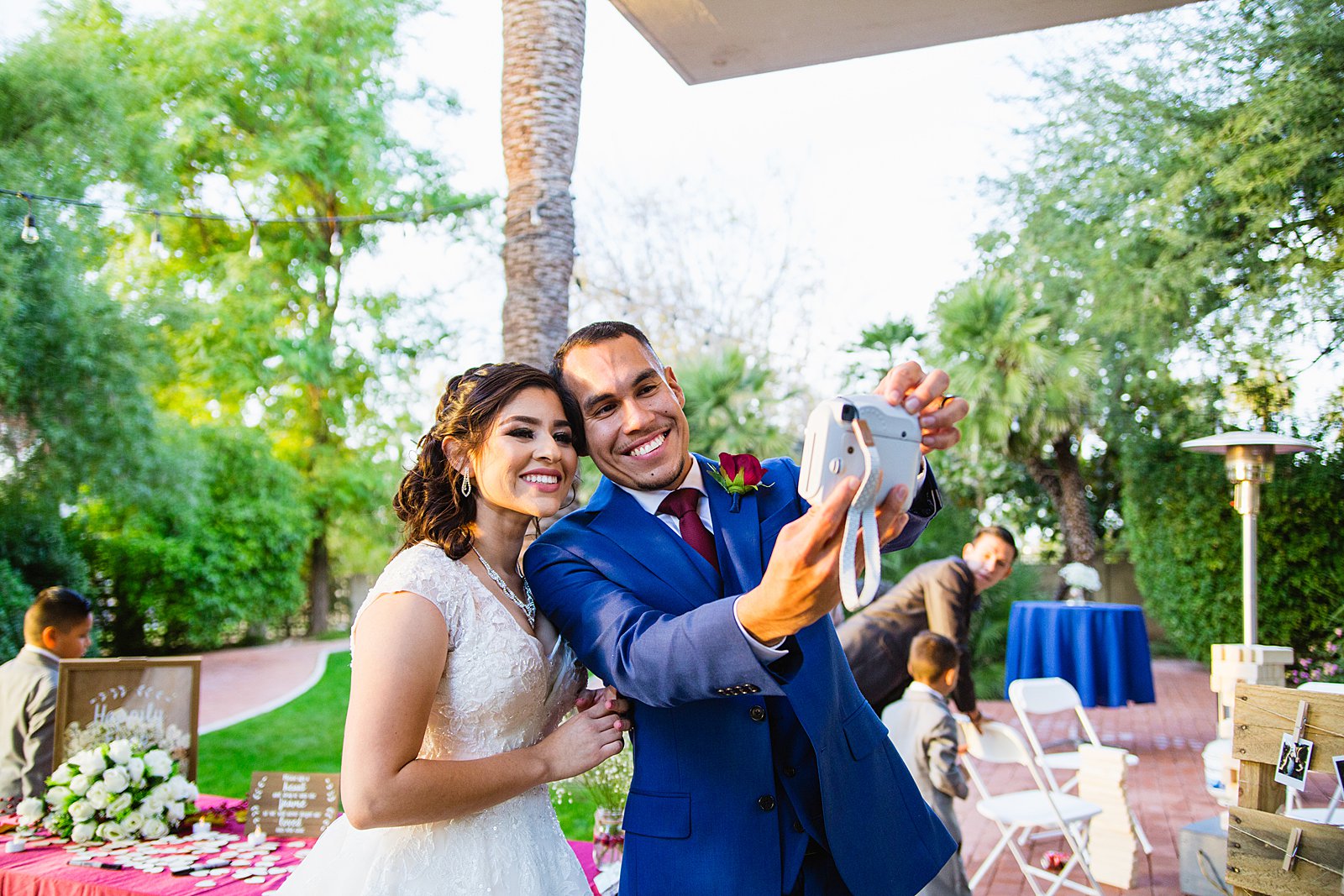 Bride and groom take a selfie at their wedding reception by PMA Photography.