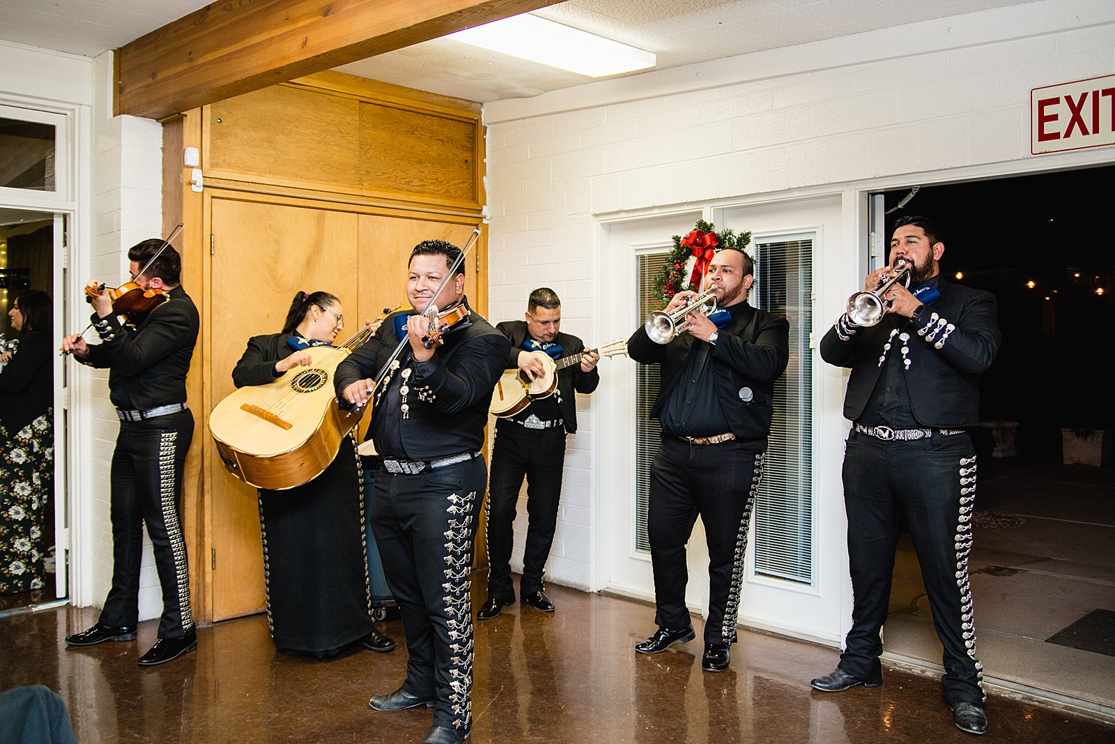 Mariachi band play for guests at a Valley Garden Center wedding reception by Phoenix photographer PMA Photography.