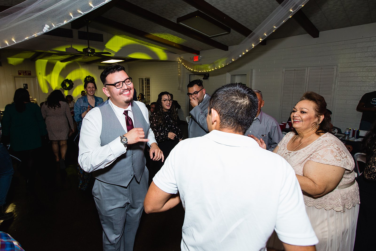 Guests dancing at Valley Garden Center wedding reception by Phoenix wedding photographer PMA Photography