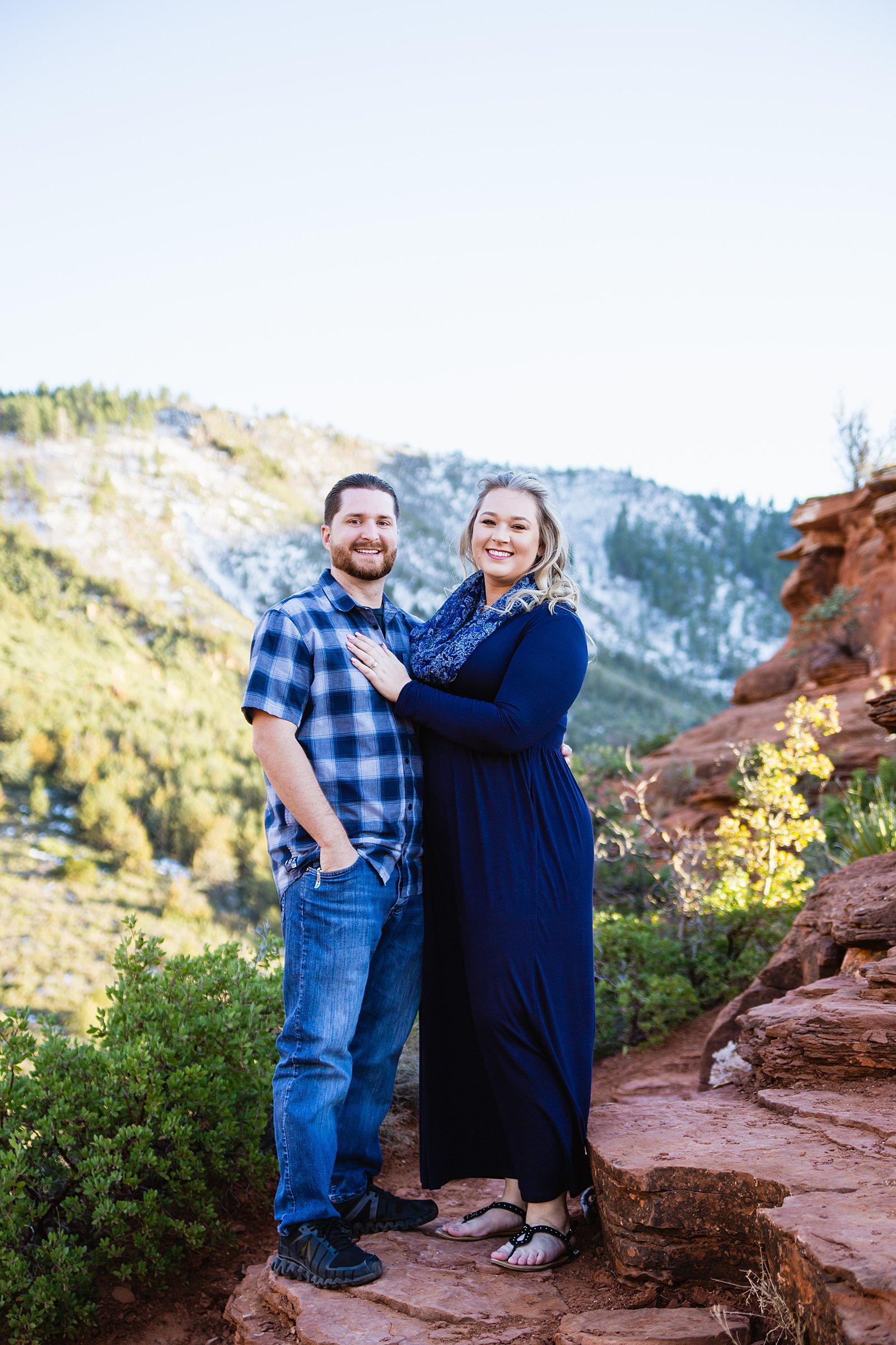 Couple pose during their Sedona engagement session by Arizona wedding photographer PMA Photography.