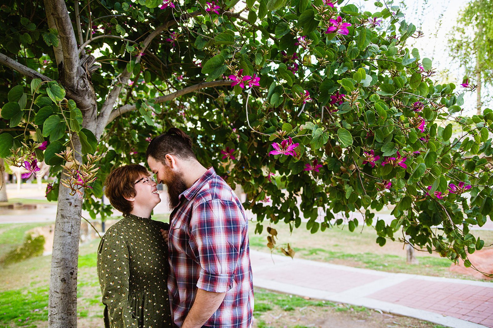 Couple share an intimate moment during their Downtown Glendale engagement session by Glendale engagement photographer PMA Photography.
