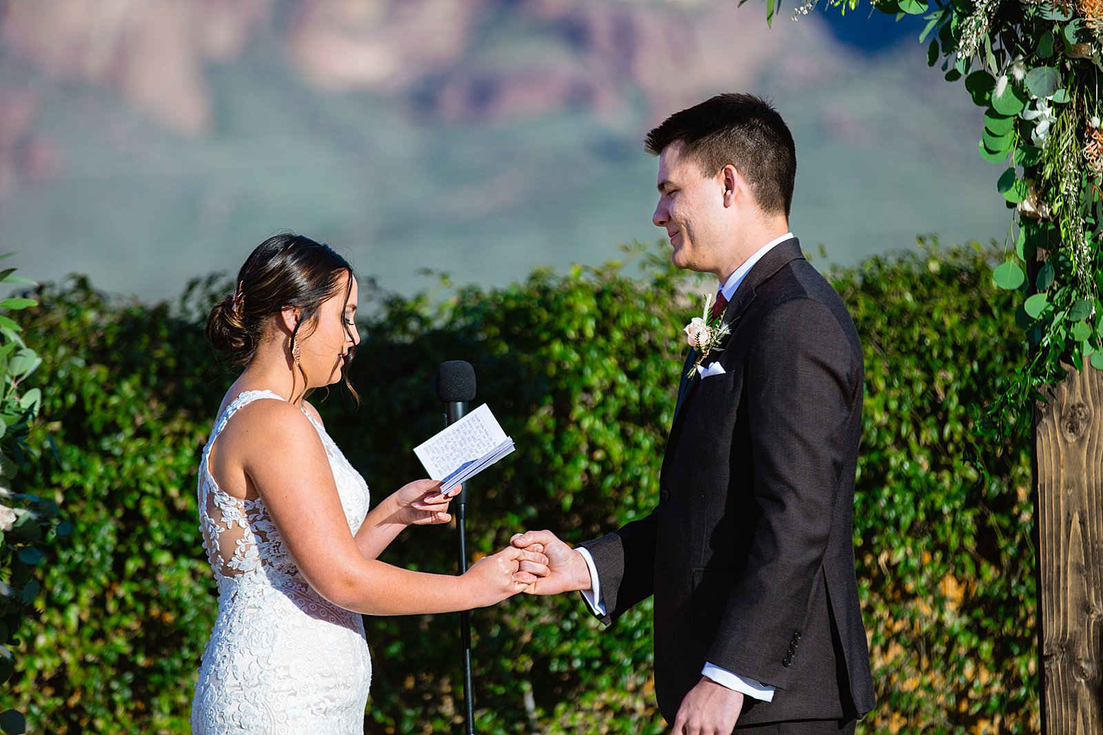Bride and Groom togethering during The Paseo wedding ceremony by Apache Junction wedding photographer PMA Photography.