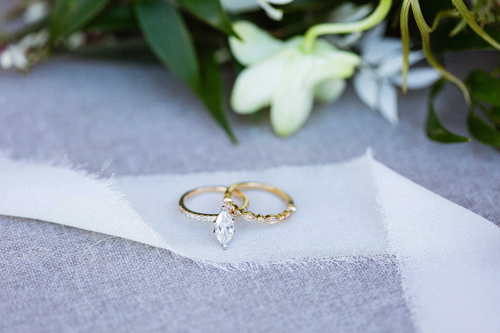 Bride's unique gold Marquise engagement ring and wedding band by PMA Photography.