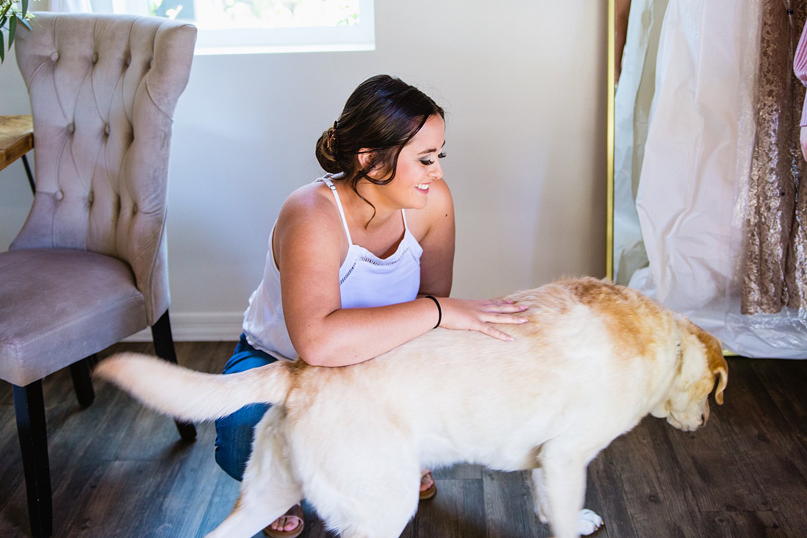Bride with her pup while getting ready for her wedding by Phoenix wedding photographers PMA Photography.