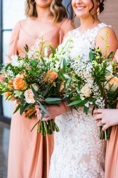Close up image of peach and green desert inspired wedding bouquets by Arizona wedding photographer PMA Photography.