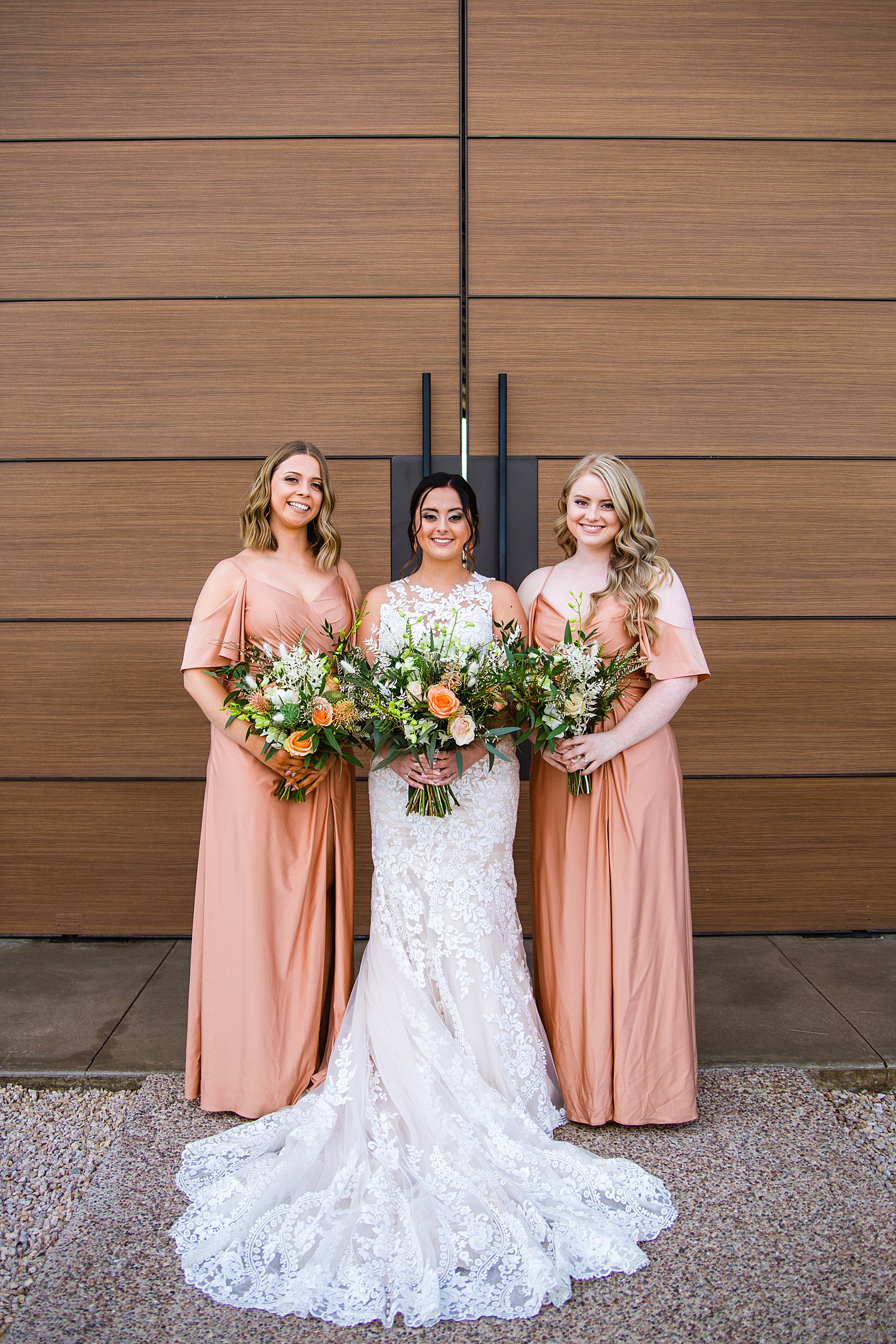 Bride and bridesmaids together at a The Paseo wedding by Arizona wedding photographer PMA Photography.
