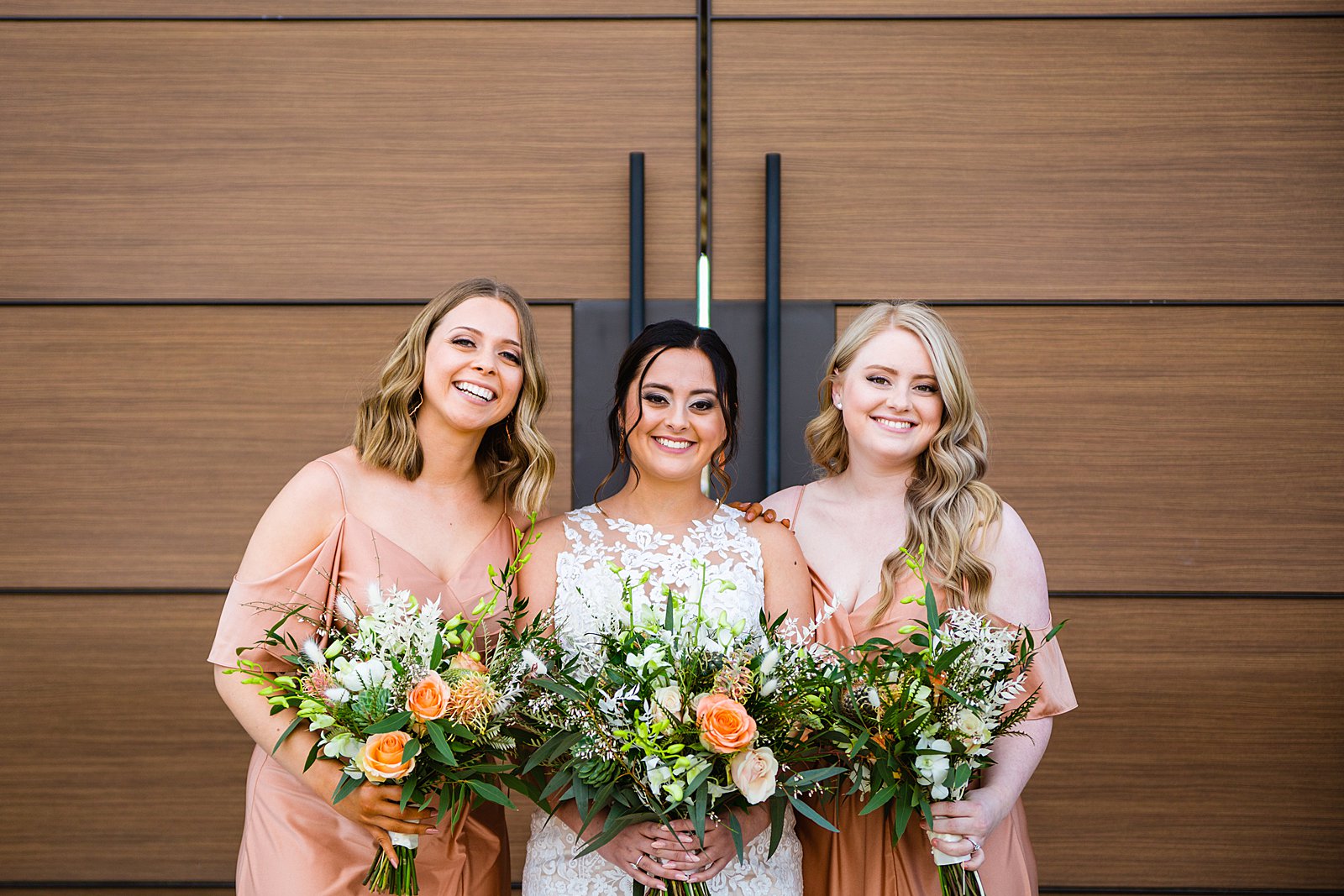 Bride and bridesmaids together at a The Paseo wedding by Arizona wedding photographer PMA Photography.