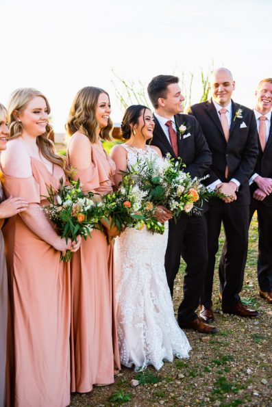Bridal party laughing together at The Paseo wedding by Apache Junction wedding photographer PMA Photography.