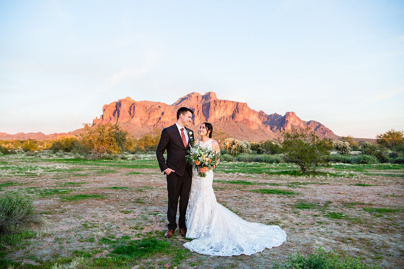 Bride and Groom pose during their The Paseo wedding by Arizona wedding photographer PMA Photography.