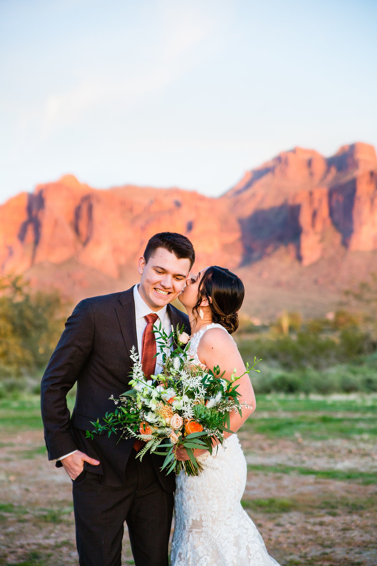 Bride and Groom laughing together during their The Paseo wedding by Apache Junction wedding photographer PMA Photography.