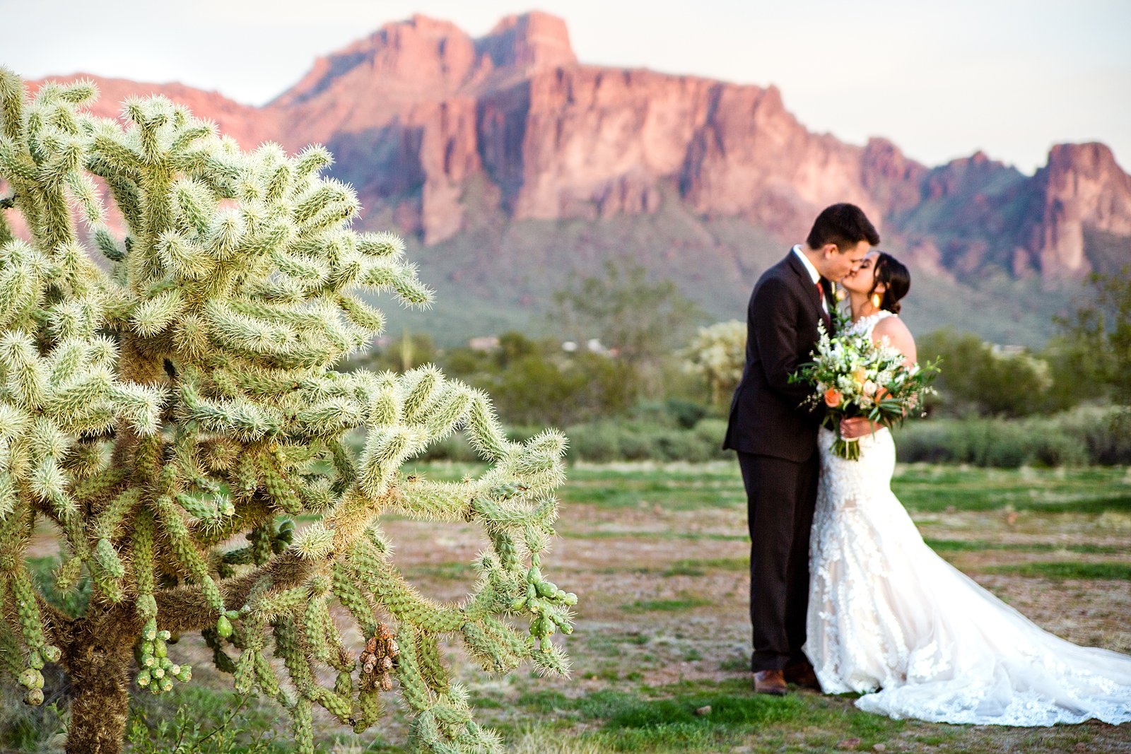 Bride and Groom share a kiss during their The Paseo wedding by Arizona wedding photographer PMA Photography.