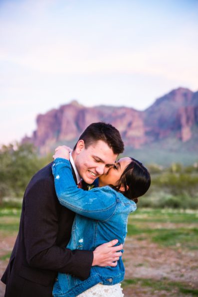 Bride and Groom laughing together during their The Paseo wedding by Apache Junction wedding photographer PMA Photography.