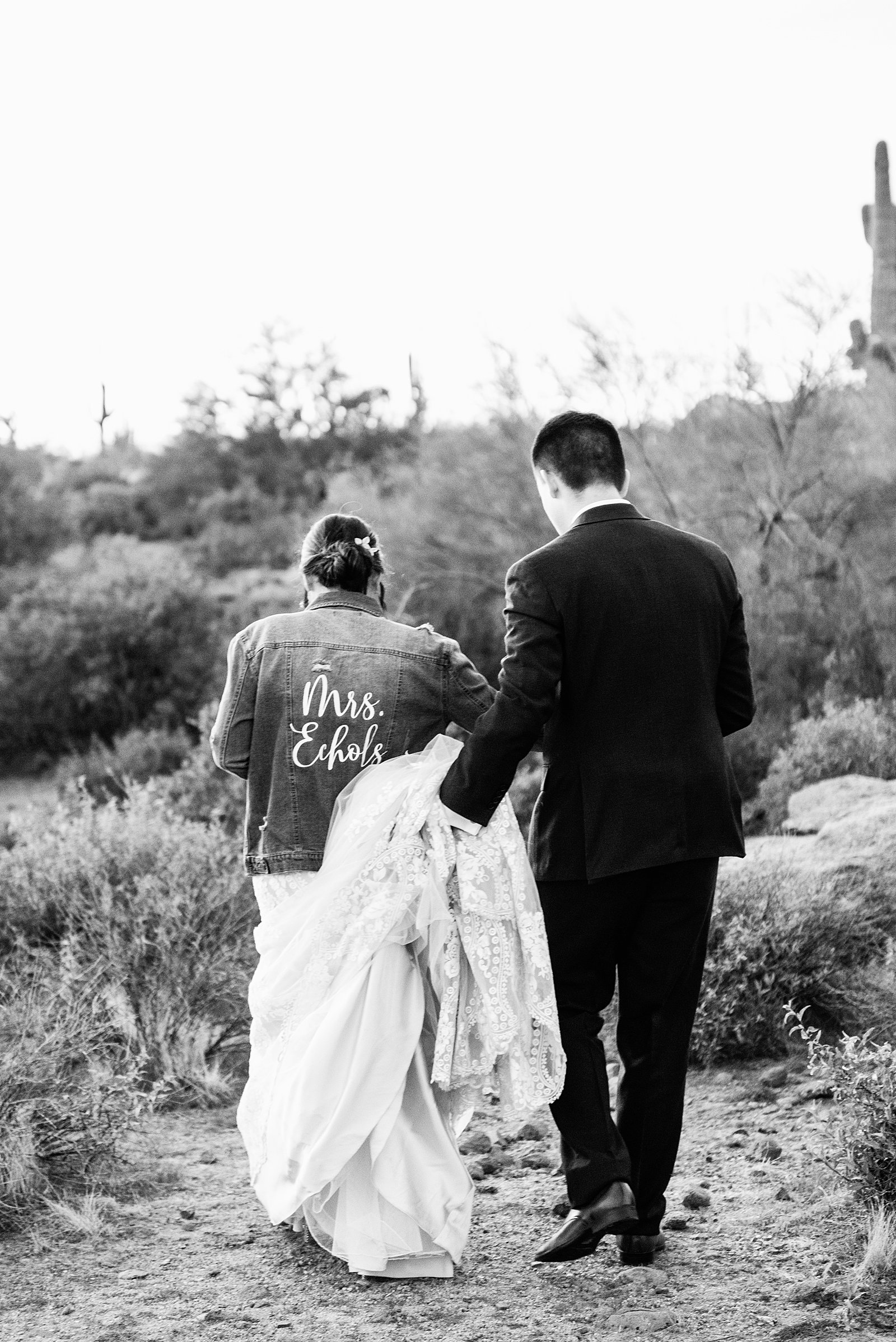 Bride and Groom walking together during their The Paseo wedding by Apache Junction wedding photographer PMA Photography.