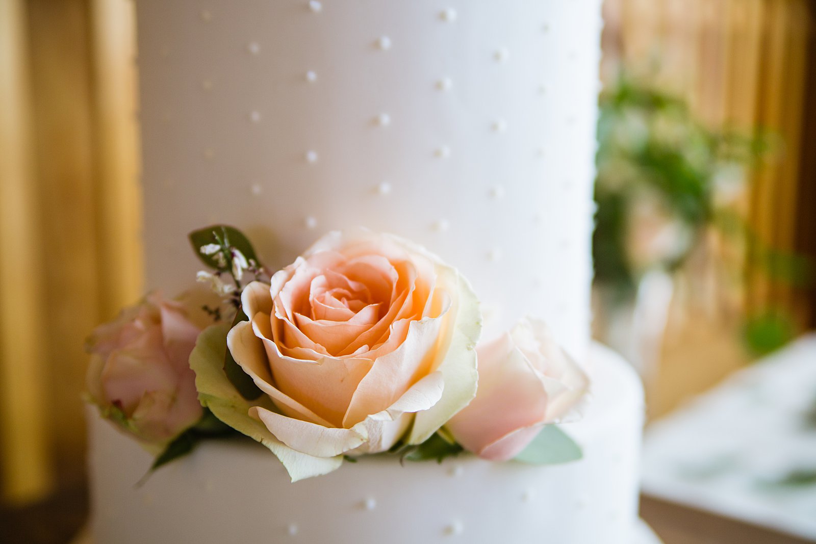 Simple white and copper wedding cake by Arizona wedding photographer PMA Photography.