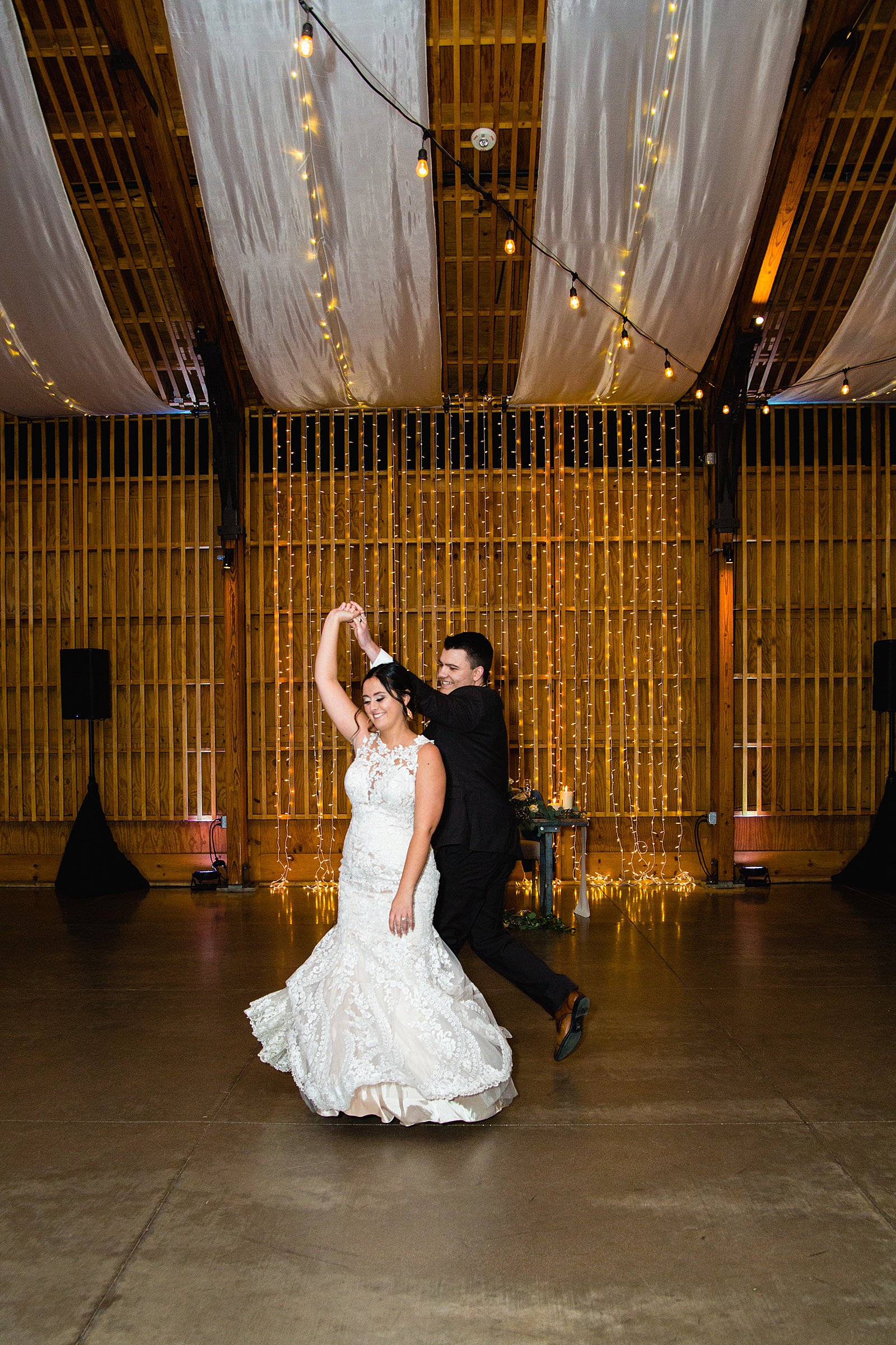 Bride and Groom sharing first dance at their The Paseo wedding reception by Arizona wedding photographer PMA Photography.