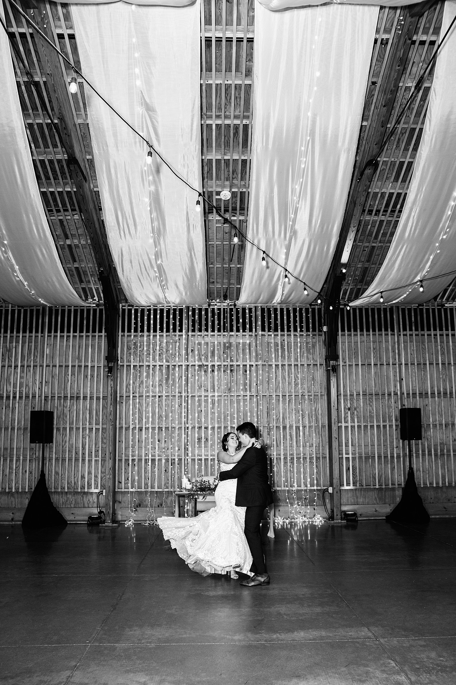 Bride and Groom sharing first dance at their The Paseo wedding reception by Arizona wedding photographer PMA Photography.