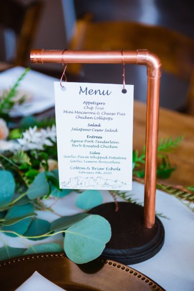 Custom DIY copper dinner menu signs reception decorations at The Paseo wedding reception by Apache Junction wedding photographer PMA Photography.