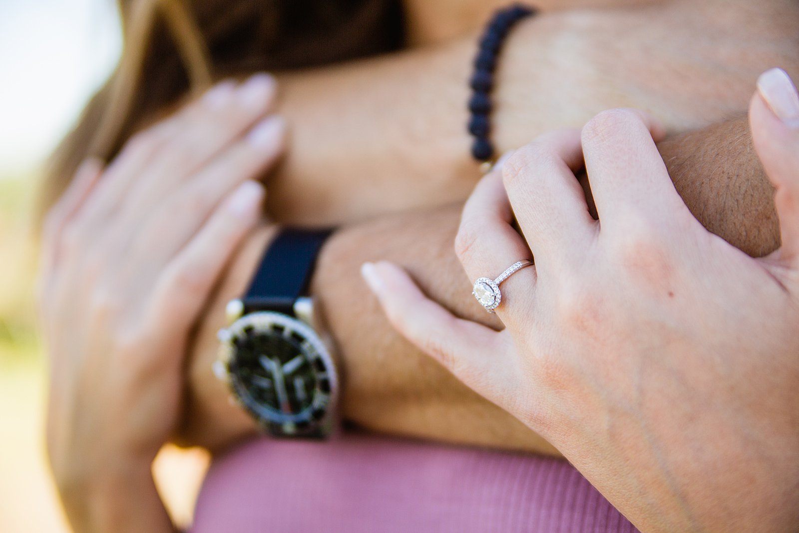 Detail image of engagement ring during during engagement session by PMA Photography.
