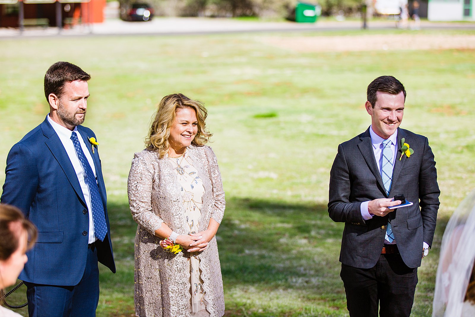 Wedding couple's family during Slide Rock wedding ceremony by Arizona elopement photographer PMA Photography.