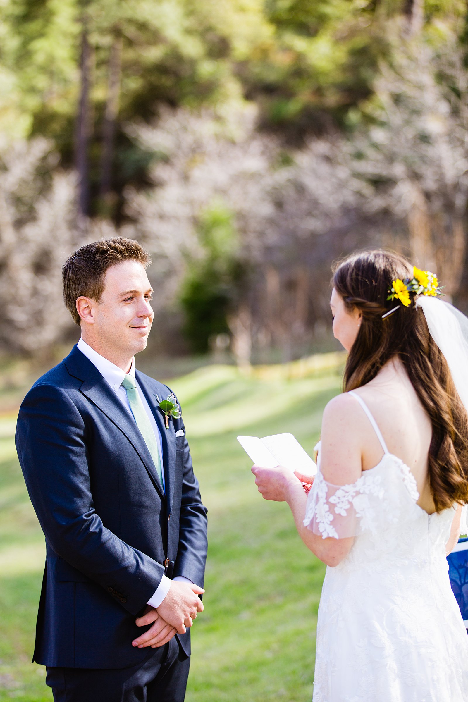 Groom looking at his bride during their wedding ceremony at Slide Rock by Sedona elopement photographer PMA Photography.