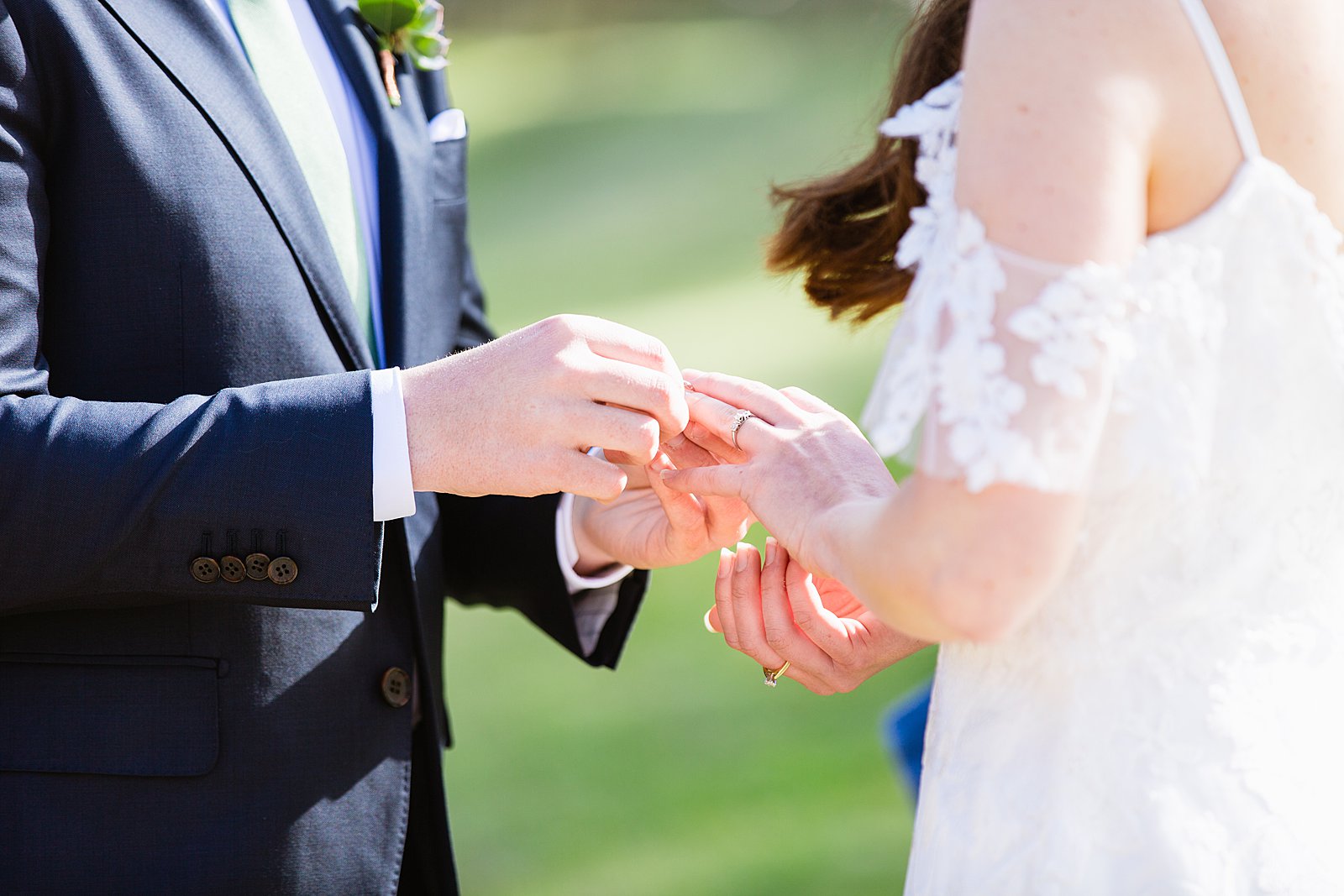 Bride and Groom exchange rings during their wedding ceremony at Slide Rock by Arizona elopement photographer PMA Photography.