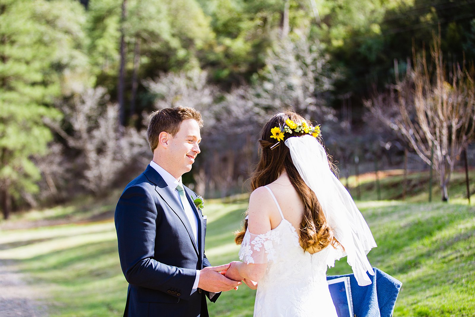 Bride and Groom exchange rings during their wedding ceremony at Slide Rock by Arizona elopement photographer PMA Photography.