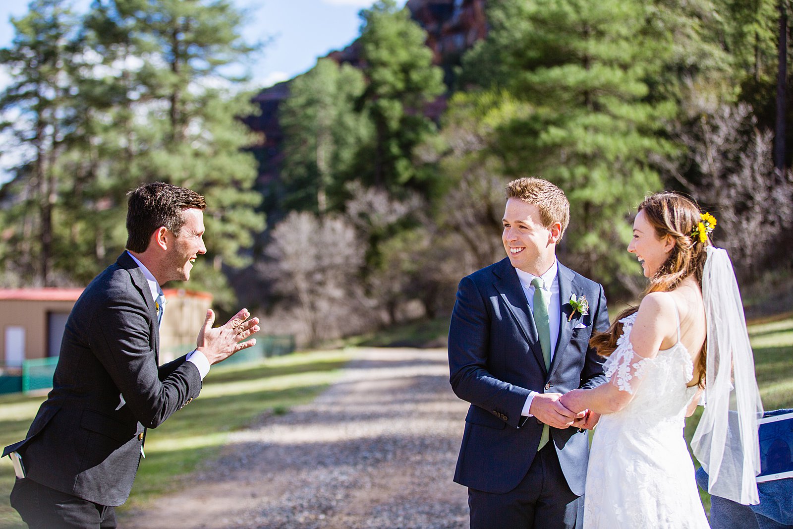 Bride's brother pronouncing them as husband and wife during their Sedona elopement by PMA Photography.