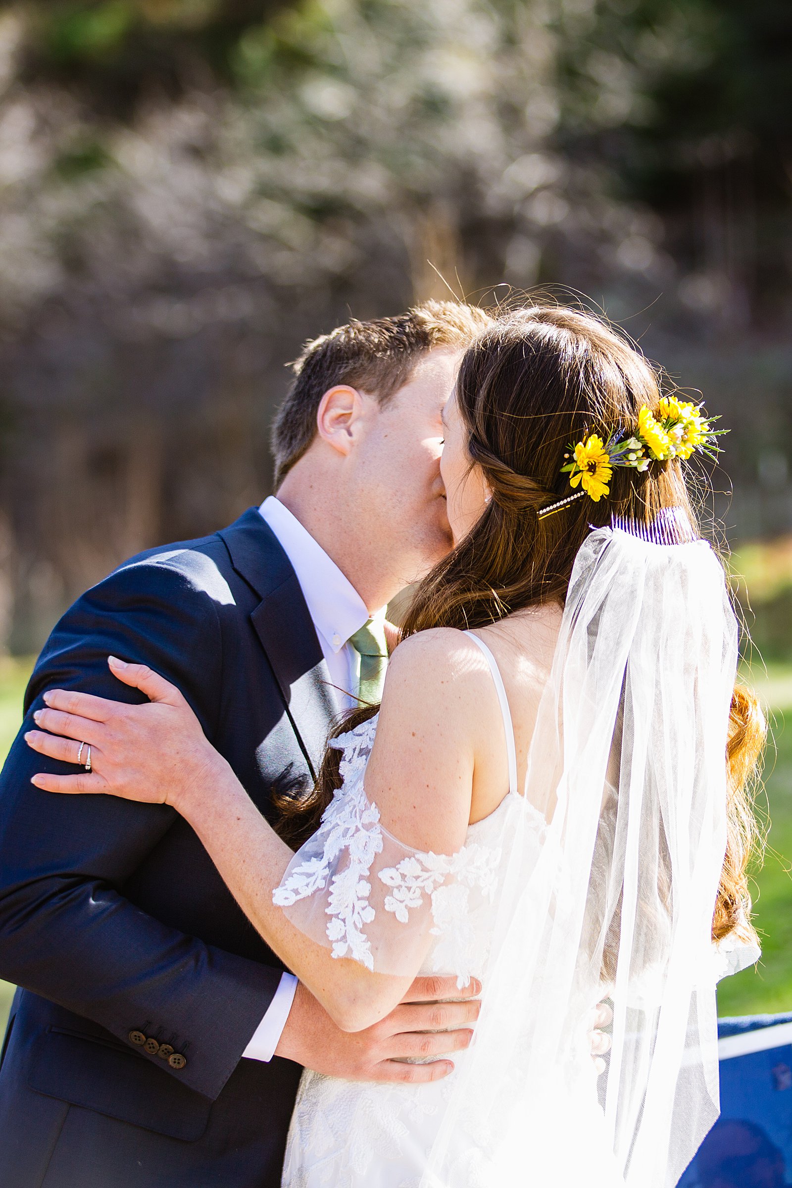 Bride and Groom share their first kiss during their wedding ceremony at Slide Rock by Arizona elopement photographer PMA Photography.