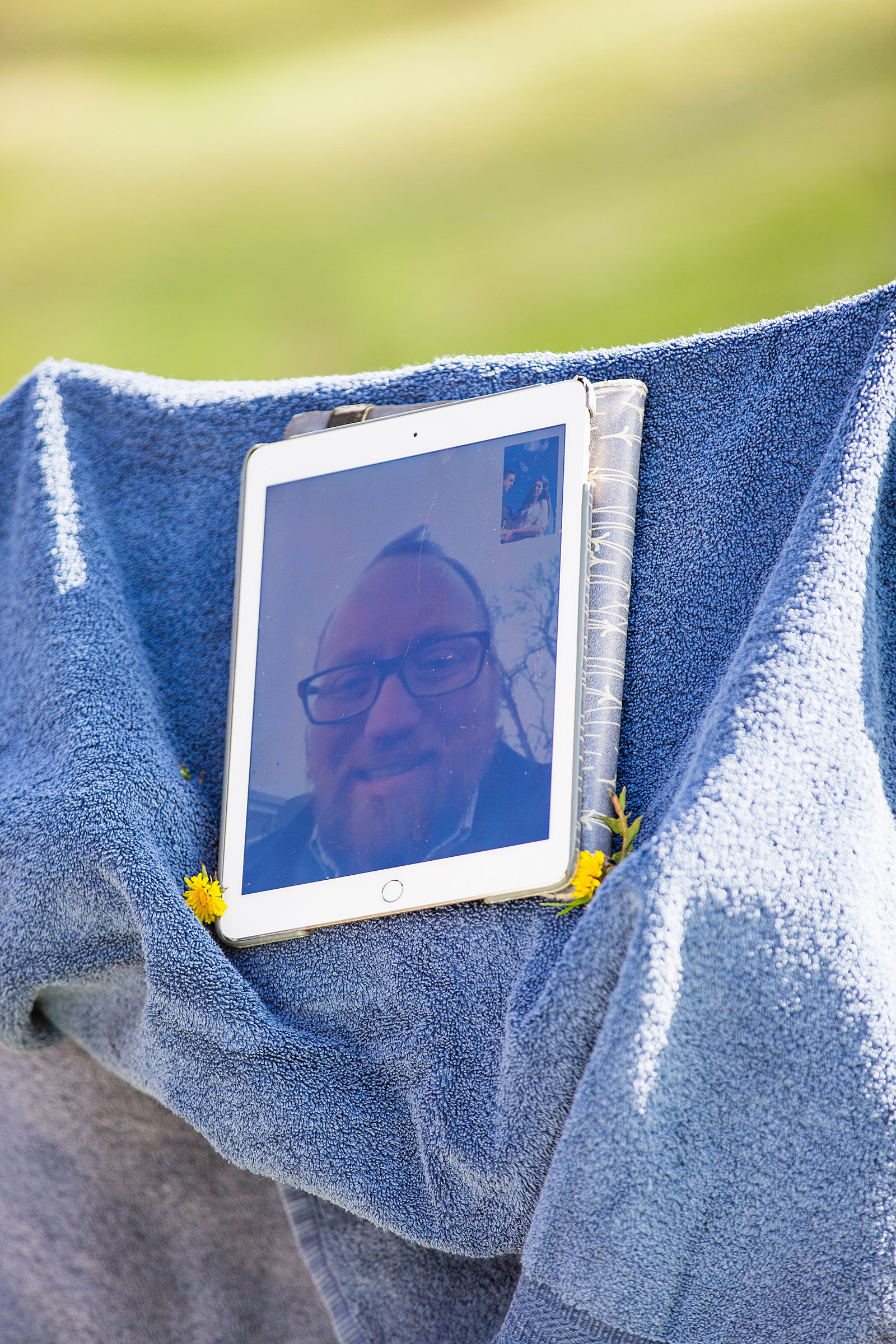 Wedding officiant Skyping in on an iPad during a Covid-19 elopement by Sedona wedding photographer PMA Photography.