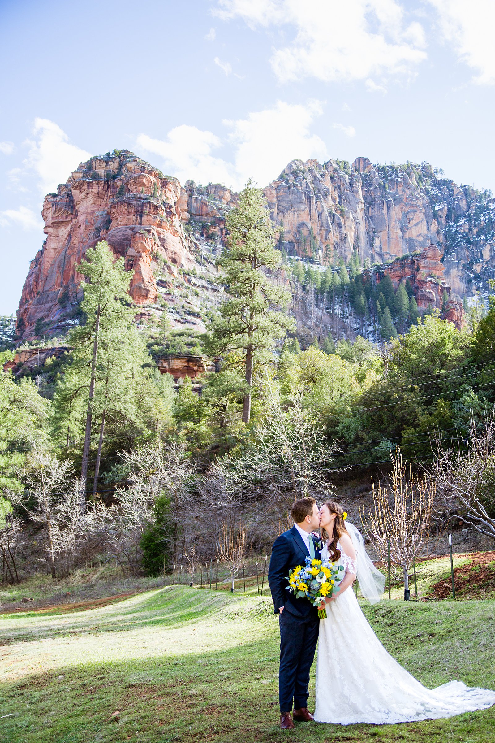 Bride and Groom share a kiss during their Slide Rock elopement by Sedona elopement photographer PMA Photography.
