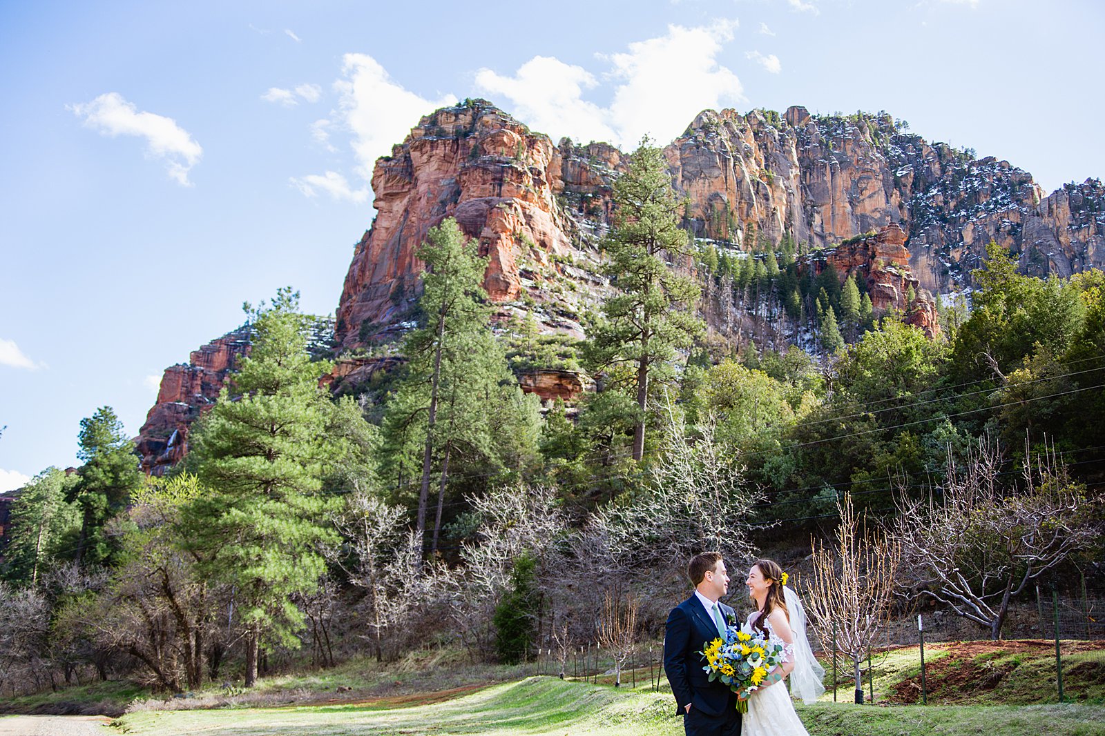 Bride and Groom looking at each other during their Slide Rock elopement by Arizona elopement photographer PMA Photography.