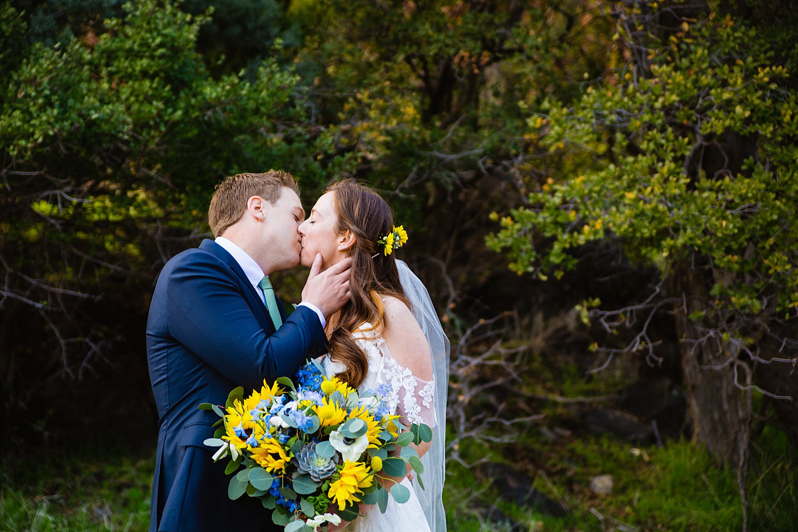 Bride and Groom share a kiss during their Slide Rock elopement by Sedona elopement photographer PMA Photography.