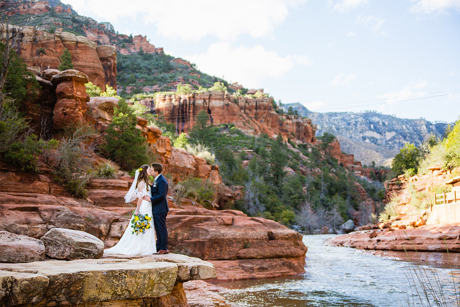 Bride and Groom share a kiss during their Slide Rock elopement by Arizona elopement photographer PMA Photography.