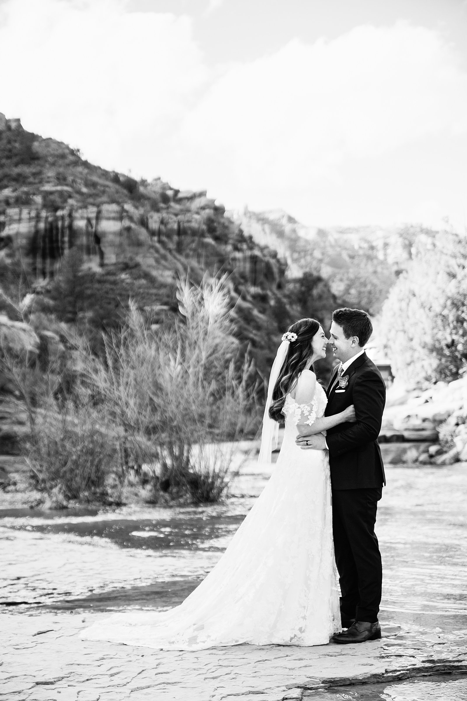 Bride and Groom share an intimate moment at their Slide Rock elopement by Arizona elopement photographer PMA Photography.