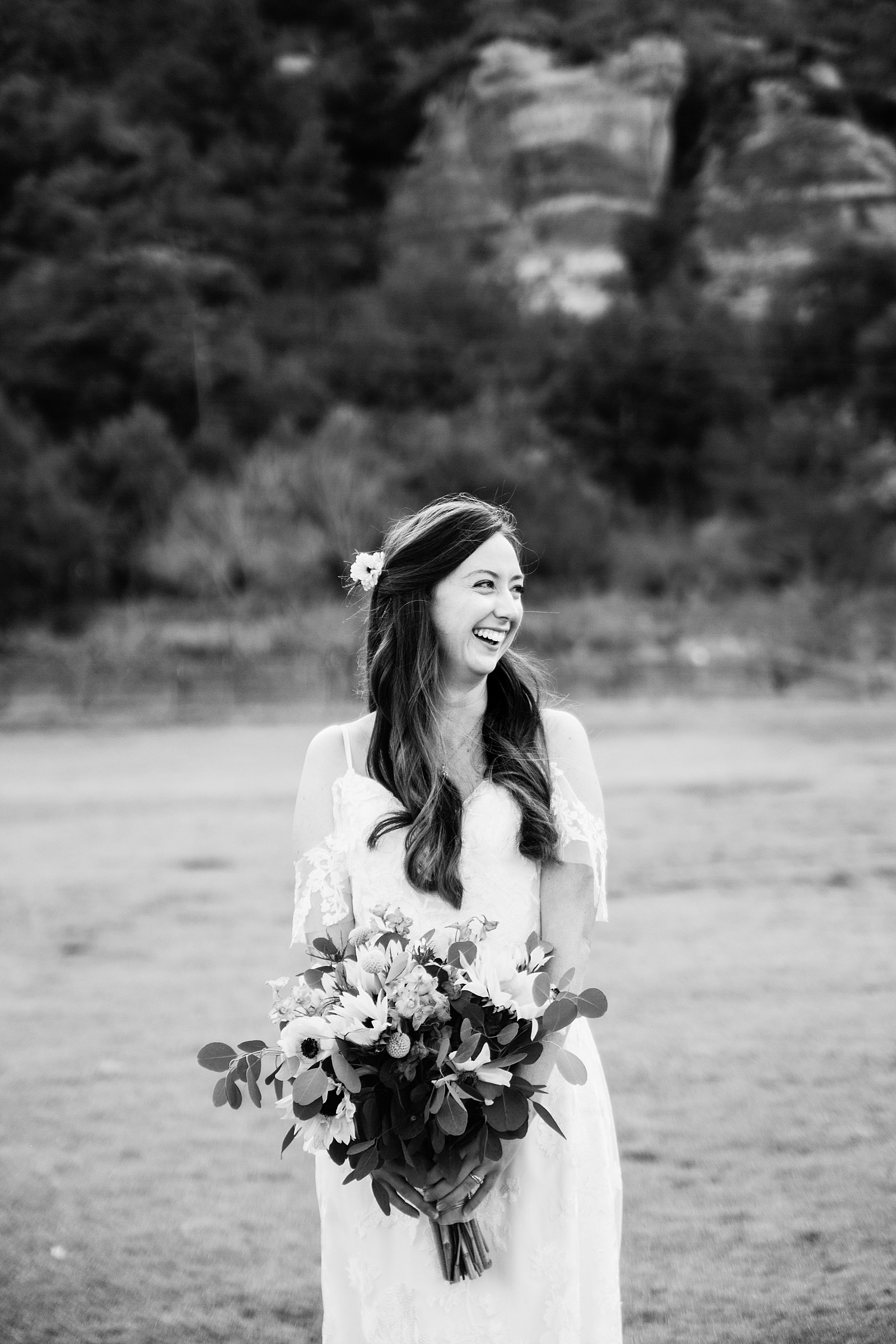 Black and white image of bride laughing during her Sedona elopement by PMA Photography.