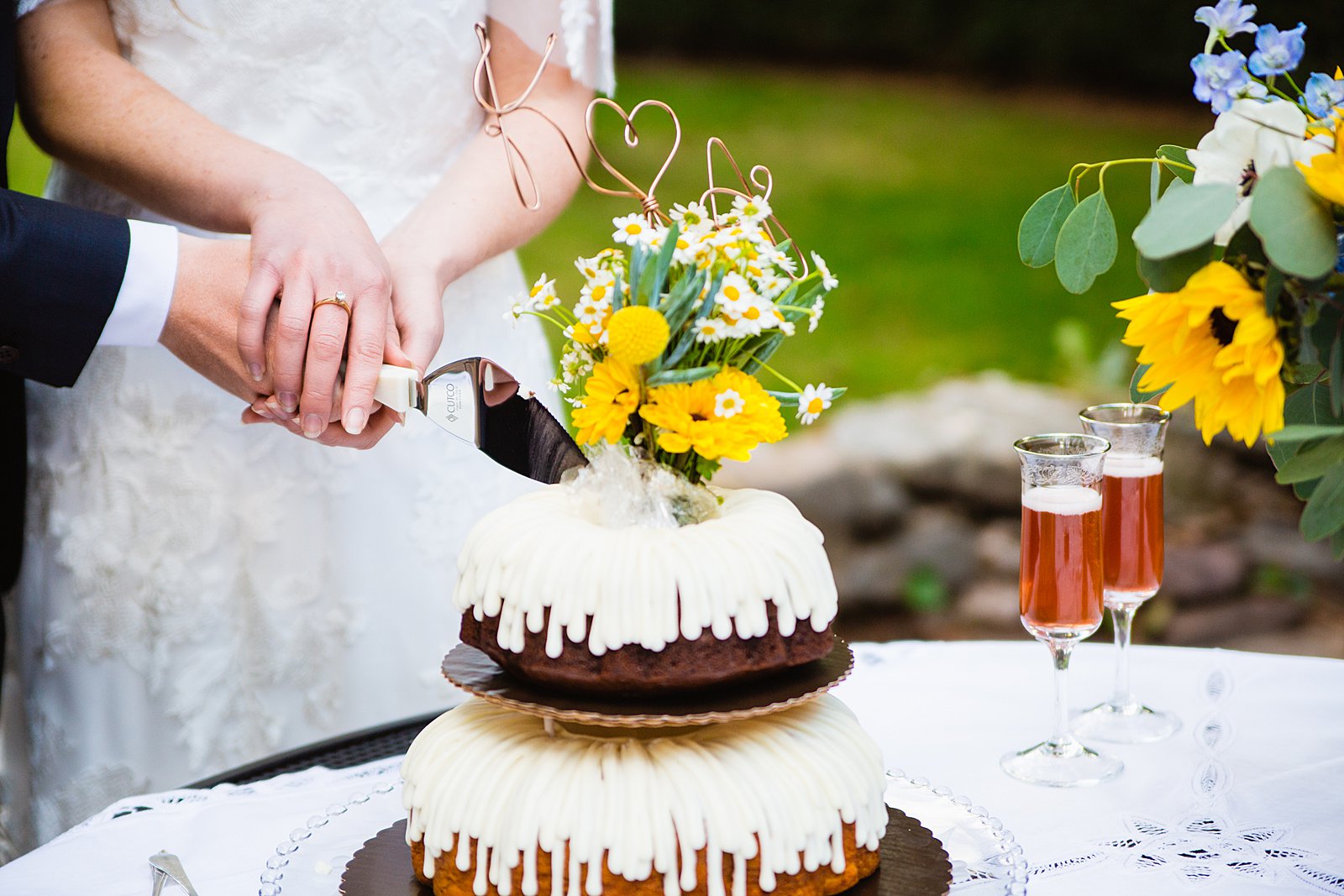 Bride and Groom share wedding cake at their Sedona elopement by Arizona elopement photographer PMA Photography.