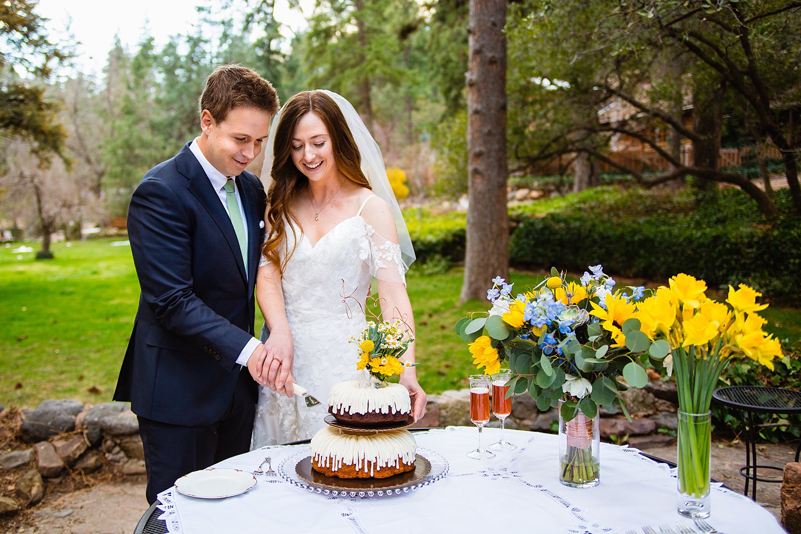 Bride and Groom share wedding cake at their Sedona elopement by Arizona elopement photographer PMA Photography.