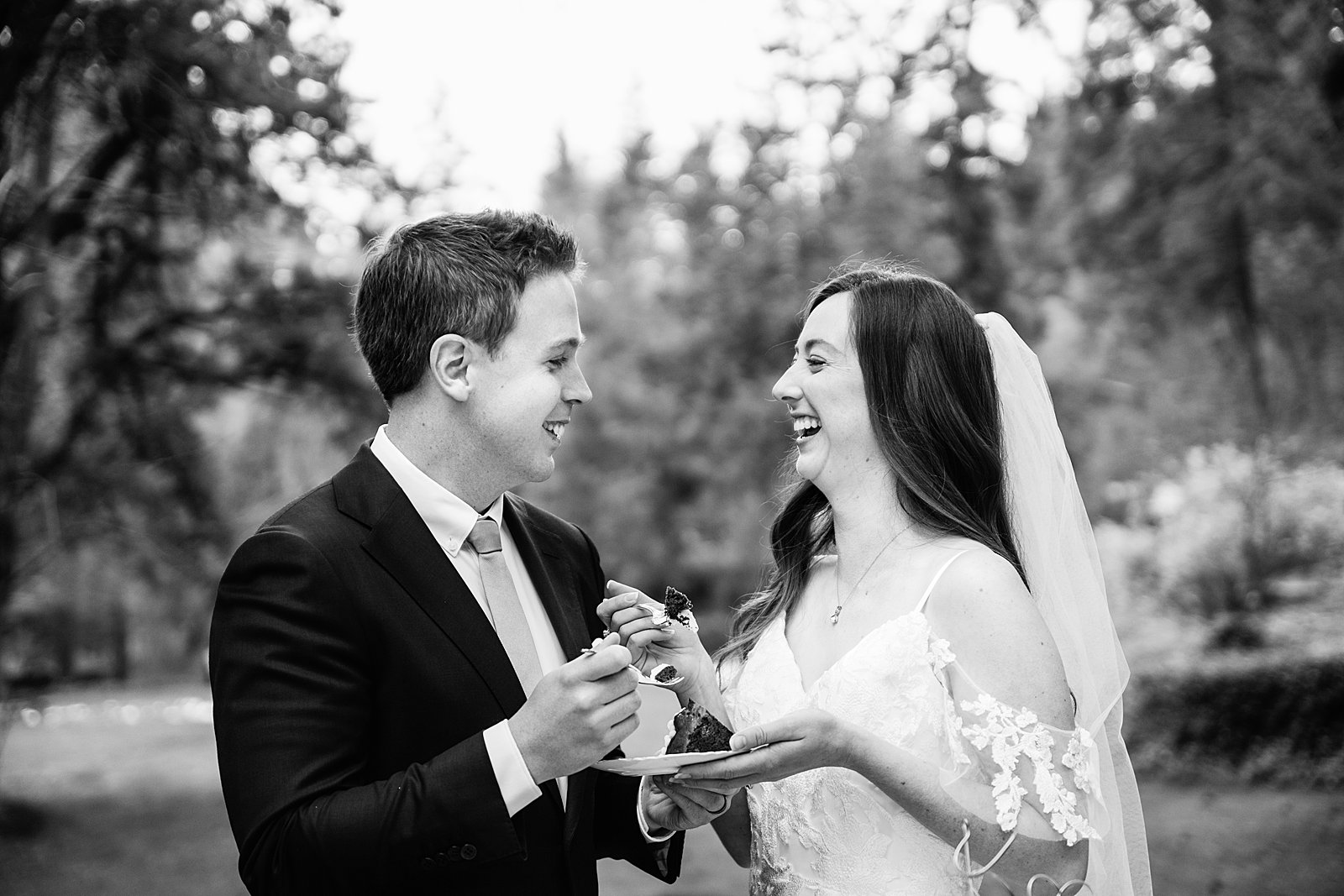 Bride and Groom share wedding cake at their Sedona elopement by Arizona elopement photographer PMA Photography.