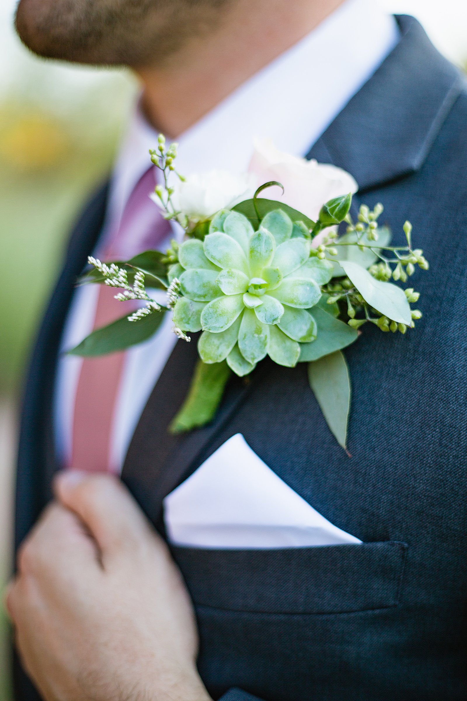 Groom's succulent and pink rose boutonniere by PMA Photography.