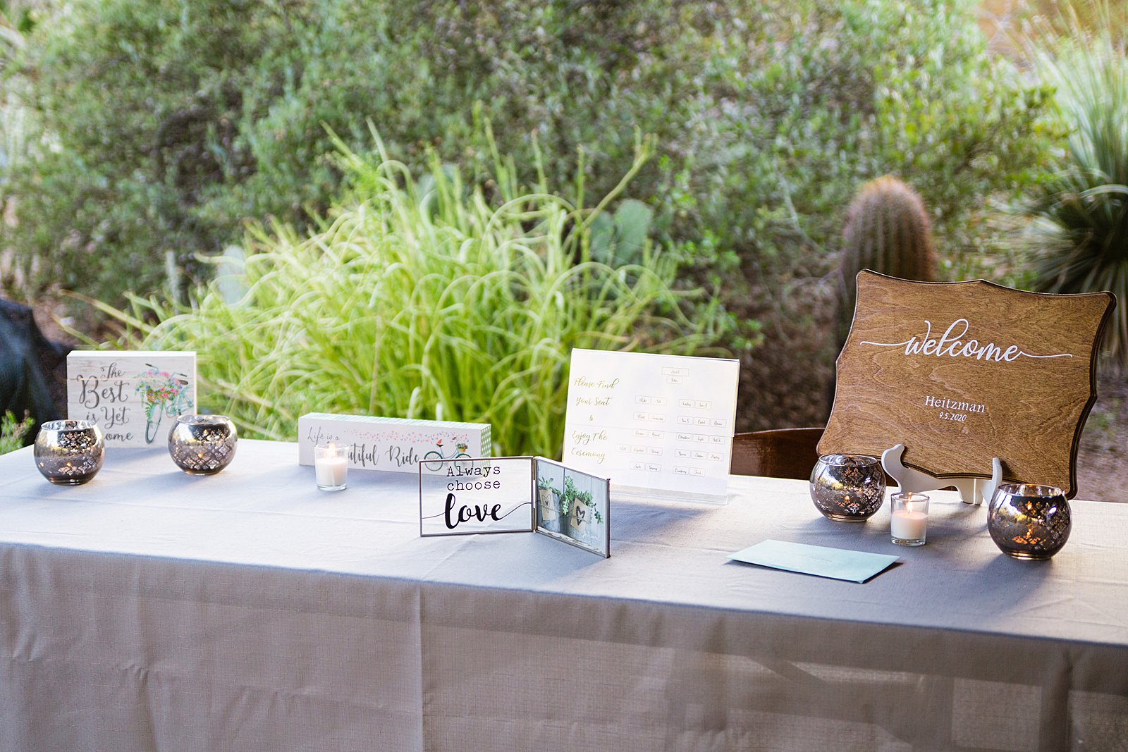 Welcome and card table decorations at a Desert Botanical Garden wedding by Phoenxi wedding photographer PMA Photography.