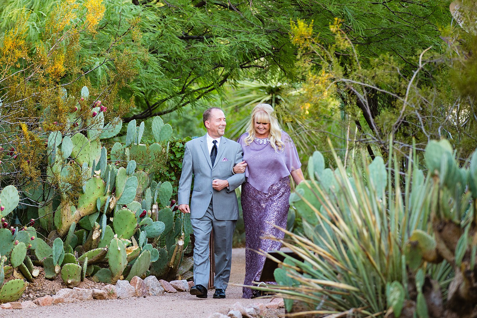 Parents of the bride walking down the aisle together by PMA Photography.