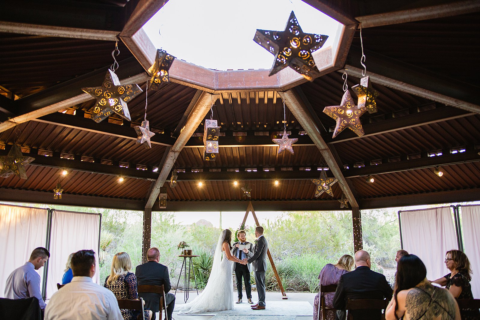 Wedding ceremony at Desert Botanical Gardens by Phoenix wedding photographer PMA Photography.