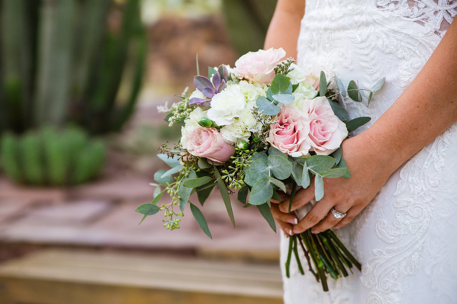 Bride's garden inspired succulent and pink rose wedding bouquet by PMA Photography.
