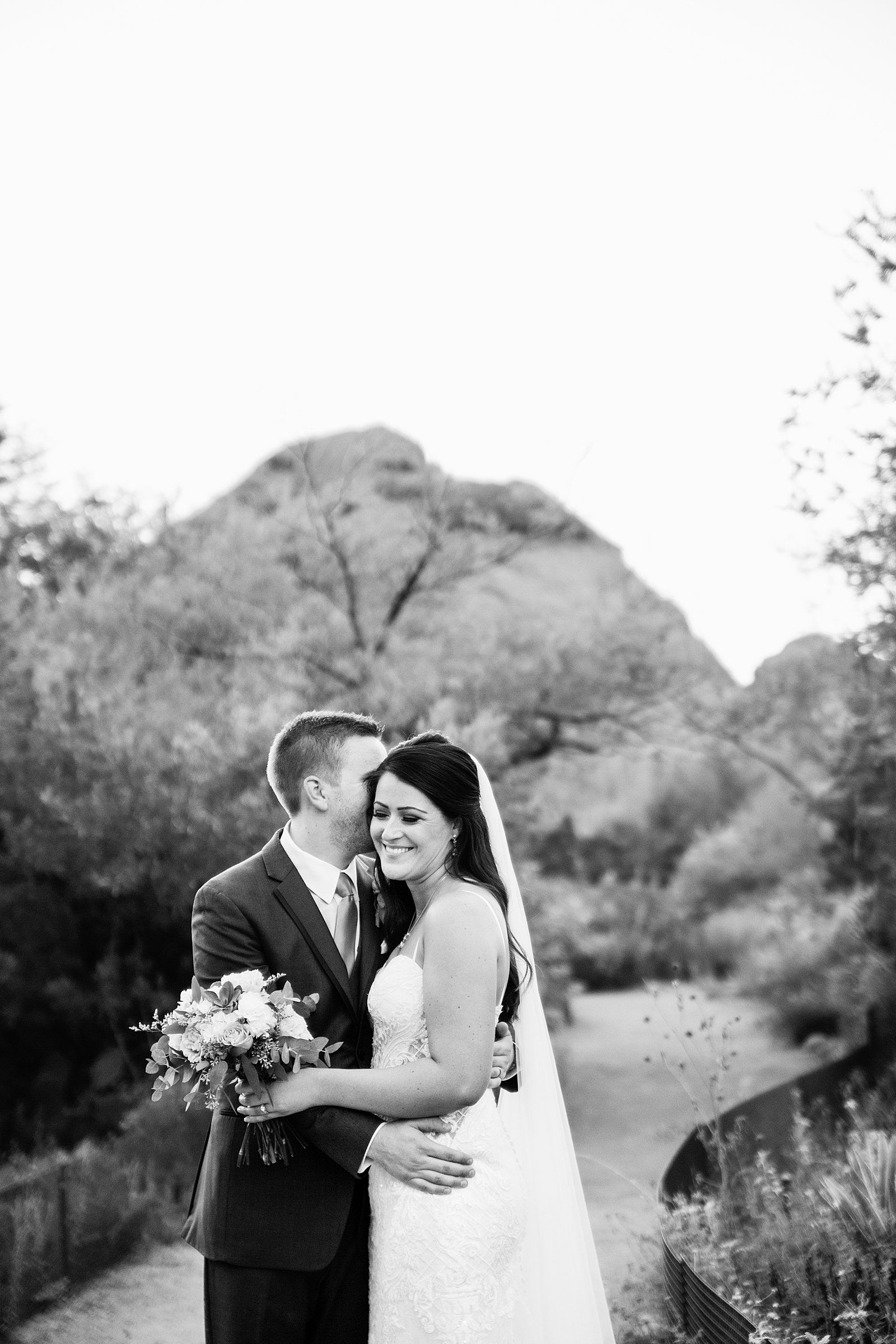 Bride and Groom share an intimate moment during their Desert Botanical Gardens wedding by Phoenix wedding photographer PMA Photography.