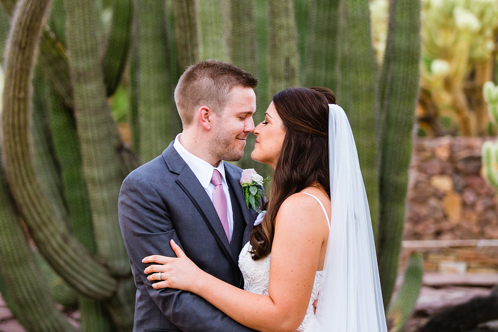 Bride and Groom share an intimate moment during their Desert Botanical Gardens wedding by Phoenix wedding photographer PMA Photography.
