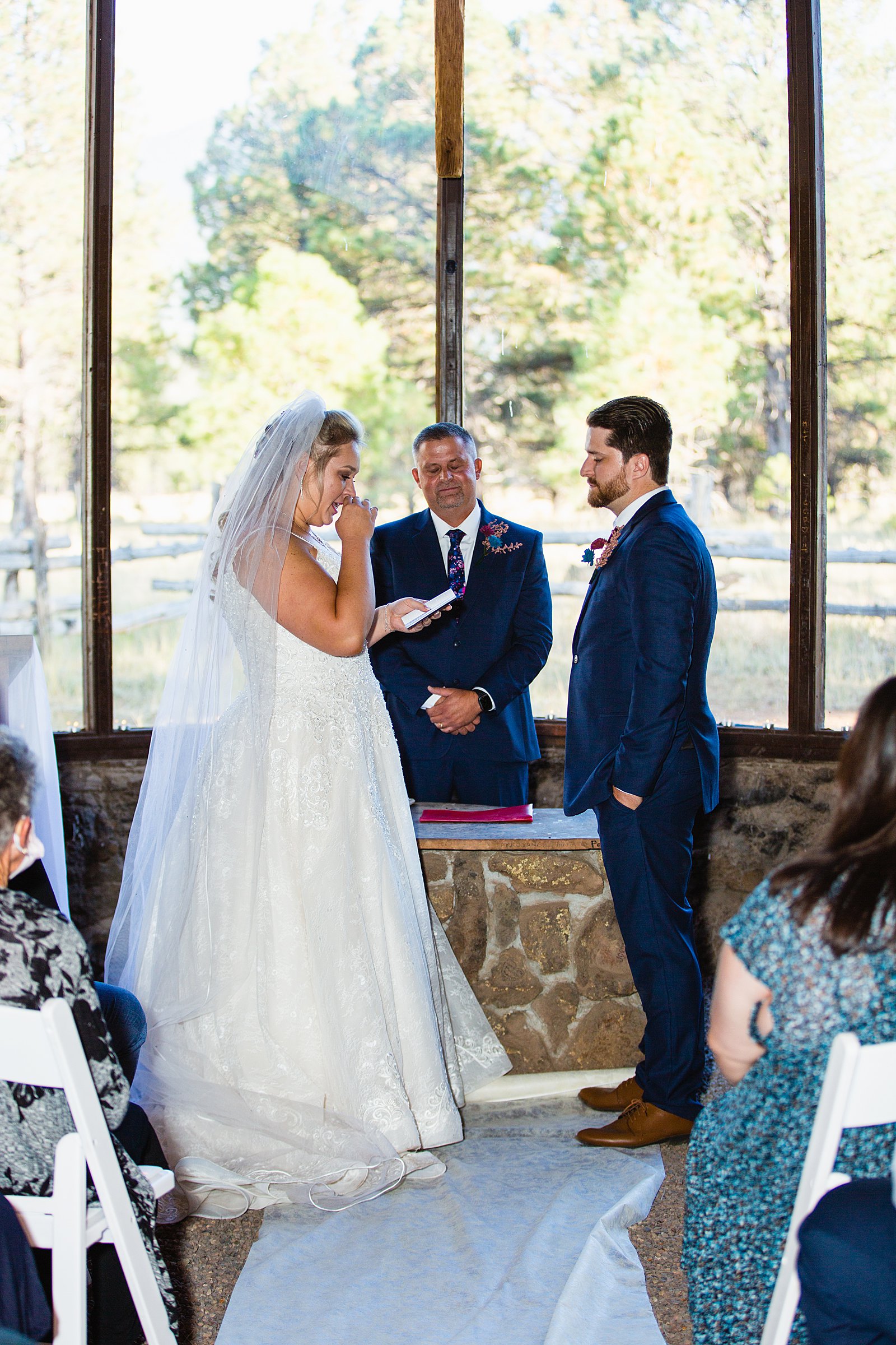 Bride reading her vows to the groom during a Chapel of the Holy Dove wedding ceremony by Flagstaff wedding photographer PMA Photography.