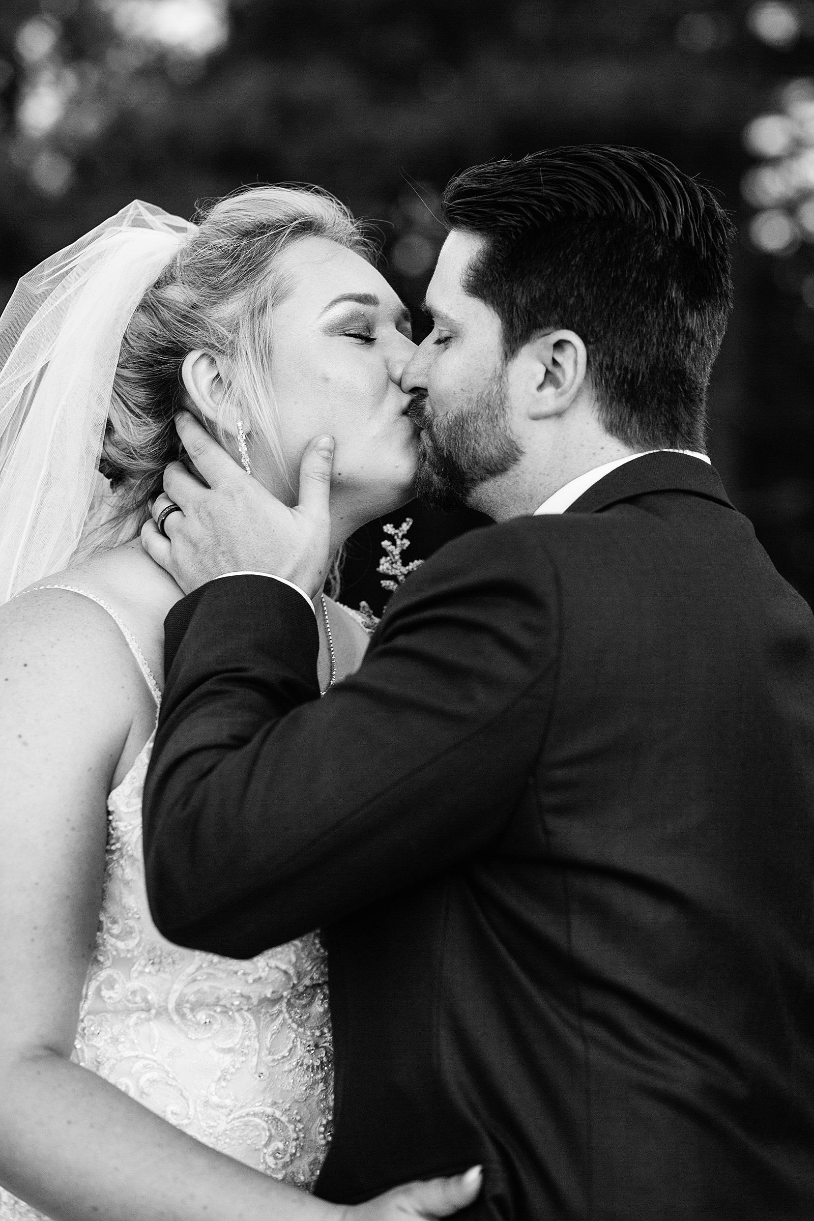 Bride and Groom share a kiss during their Chapel of the Holy Dove wedding by Flagstaff wedding photographer PMA Photography.